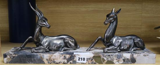 An Art Deco bronze and marble group of two deer